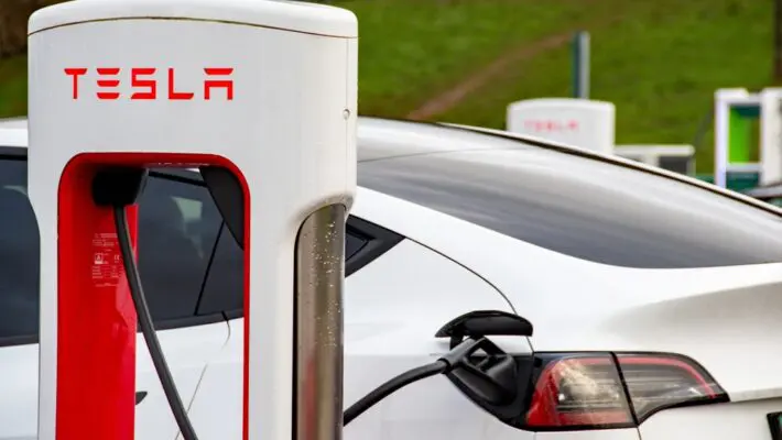 Tesla has almost halved the cost of leasing its electric cars in Britain, in a bid to reverse sliding sales and shore up its market share against fast-growing Chinese competitors.
