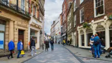 Britain's high streets enjoyed a welcome lift last month as an early Easter drew shoppers back through the doors, but retailers are warning that the bounce may prove fleeting as a fresh wave of tax rises and wage costs bears down on the sector this month.