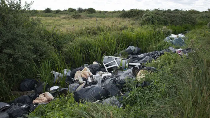 Earl Spencer has said organised fly-tipping forced his family to sell the 310 acres of Northamptonshire farmland it had farmed since 1893.