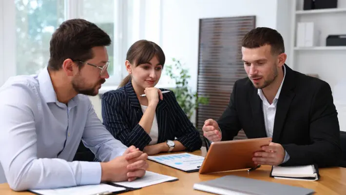 EY is urging its junior staff to get back into the office more often to sharpen the softer skills that industry executives believe will become increasingly important as the use of artificial intelligence grows.