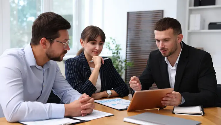 EY is urging its junior staff to get back into the office more often to sharpen the softer skills that industry executives believe will become increasingly important as the use of artificial intelligence grows.