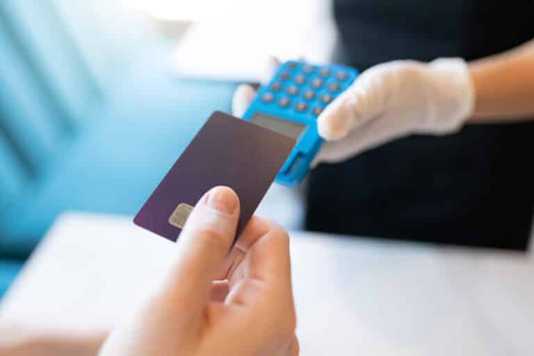 Customer Paying Through Credit Card In Restaurant