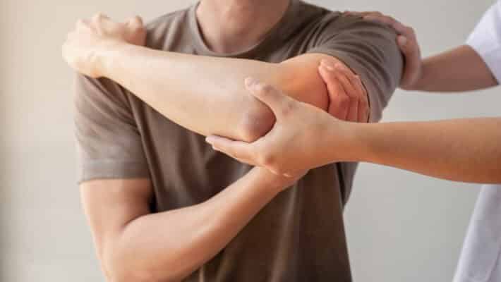 Female,Physiotherapists,Provide,Assistance,To,Male,Patients,With,Elbow,Injuries