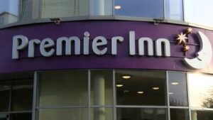 Premier Inn owner Whitbread has said it will pay millions in wage rises and bonuses to try to combat what it calls persistent staff shortages.