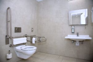 About 500 new large accessible toilets for severely disabled people are to be installed across England after the government awarded £23.5m of funding.