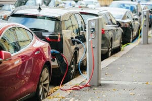 Plans to ensure half of all new cars sold in the UK are fully electric by 2028 will drive down electric vehicle (EV) prices "further and faster," experts have said.