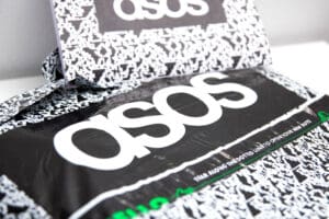 Asos is to write off more than £100m of stock and cut costs after diving into the red after its annual sales growth almost halted as shoppers hit by the cost of living crisis reined in spending on fashion.