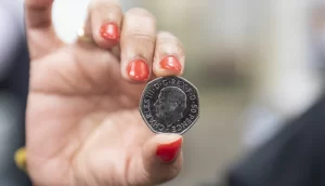 The first coins bearing the official effigy of the King have appeared in circulation in post offices around the UK.