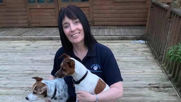 The owner of a pet hotel has said she faces bankruptcy if she loses a libel claim for lashing out at a dressage rider on Facebook over a dead pony.