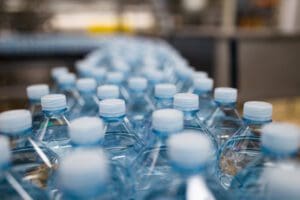 Restrictions should be put on bottled water advertising and a 10p tax should be added to shrink-wrapped packs to curb the UK’s 10m bottle-a-day habit, according to campaigners hoping to tackle the plastic pollution crisis.