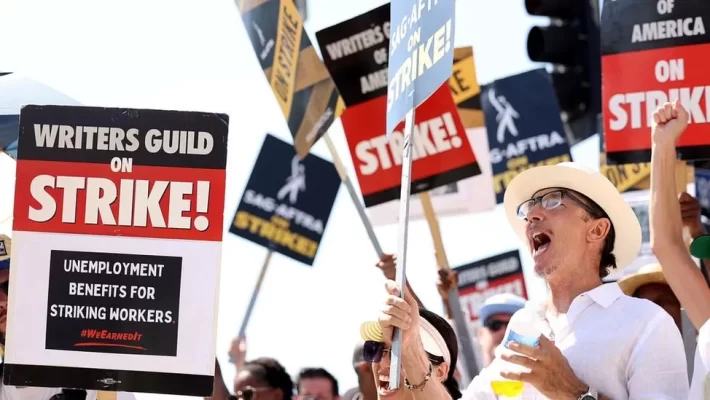Screenwriters in the US say they have reached a tentative deal with studio bosses that could see them end a strike that has lasted nearly five months.