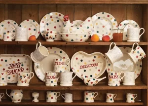 Emma Bridgewater’s pottery company reports a £1.4m loss due to rising production and staffing costs, despite a 9% increase in sales. The brand responds with job cuts and a review of inventory levels.