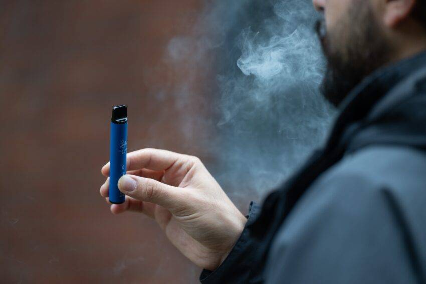 An e-cigarette, or vape, is a battery-operated device used for inhaling vapor with nicotine and flavoring.