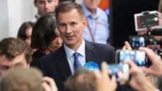 Jeremy Hunt has narrowly retained his seat in Surrey, defying predictions that he would become the first chancellor in history to lose his seat in a general election.