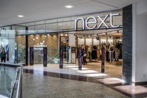 Next warns of possible store closures after losing a £30 million equal pay case involving female store staff. The retailer is appealing the ruling, which could impact profitability and lead to further high street closures.